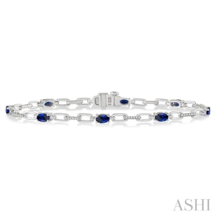 1/6 Ctw Round Cut Diamond & 5x3 MM Oval Cut Sapphire Precious Bracelet in 10K White Gold