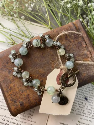 prehnite gemstone, bronze metal, wire wrapped, bracelet, jewelry.